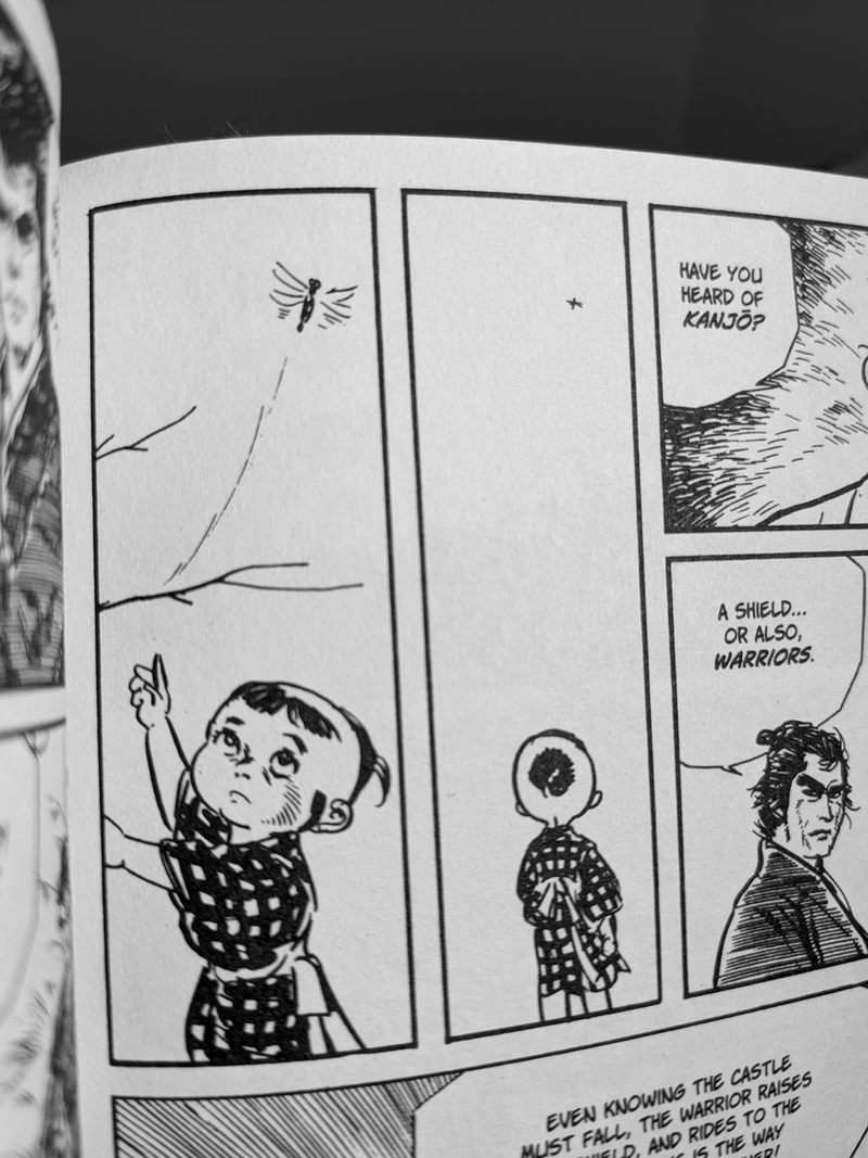 A photo of a panel from Lone Wolf and Cub. The little boy Daigoro is reaching up in the air, trying to catch a dragonfly.